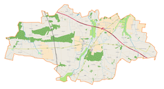 Mapa konturowa gminy Wartkowice, blisko centrum na lewo u góry znajduje się punkt z opisem „Wólki”