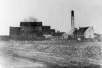 The washhouse building on the left and the boiler chimney on the right around 1900 (the well building is already demolished here).