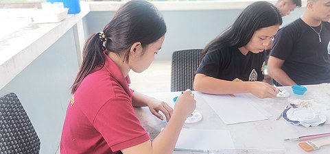 Meriam and Sheryl doing their artworks