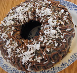 Chocolate Bundt cake frosted with coconut