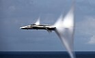 File:F-A-18C Hornet in transonic flight, with condensation cones.jpg