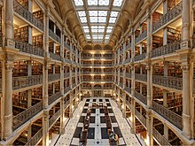 The interior of George Peabody Library at the Peabody Institute at Johns Hopkins University is renowned for its beauty. George-peabody-library.jpg