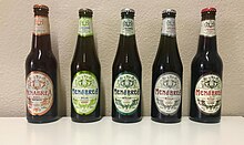 Vier 33-cl-Bierflaschen der 150-Jahr-Jubiläumsreihe von Menabrea