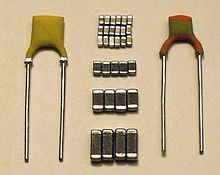 A selection of ceramic capacitors: fixed leaded disc capacitors on the left and right; multilayer ceramic chip capacitors (MLCC) in the middle MLCC-Scheiben-Kerkos-P1090142c.jpg