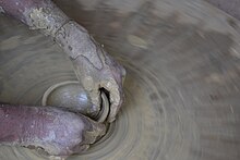 Pottery being made on a wheel, by Dolon Prova Making pottery products 1.jpg