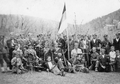 Припадници Динарске четничке дивизије са српском националном тробојком
