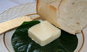 English: A pat of butter, served on a leaf, wi...