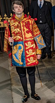 Dominic Ingram, in his tabard as Portcullis Pursuivant at the state opening. Dominic Ingram 2022.jpg