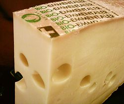 Emmentaler cheese. While some Swiss types are AOP restricted, generic Emmentaler is produced around the world. Emmentaler.jpg