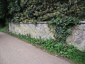 Millstones in garden wall near the site of Coombe Mill. Picture credit: Know Your Place web site.