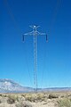 The Pacific DC Intertie along a service road paralleling U.S. Highway 395. Many of the towers of the Intertie are of this simple, slender design