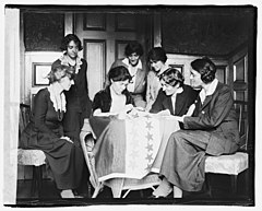 Sewing stars on a suffrage flag. Sewing stars on suffrage flag LCCN2016827559.jpg
