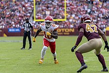 Hill playing against the Washington Football Team in 2021 Tyreek Hill, Khaleke Hudson (51615697528).jpg