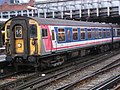 A south London electric train in modified N.S.E. livery with 'rounded line corners'