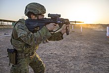 An Australian soldier wearing the Australian Multicam Camouflage Uniform while firing his rifle Australian soldier firing an EF88 assault rifle in 2018.jpg