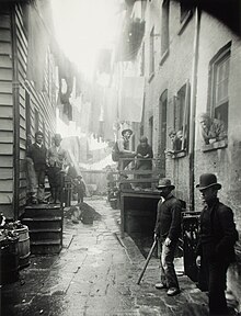 Jacob Riis, Bandit's Roost, 1888, from How the Other Half Lives. This image is Bandit's Roost at 59 1/2 Mulberry Street, considered the most crime-ridden, dangerous part of New York City. Bandit's Roost by Jacob Riis.jpeg