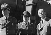 Albert Speer (far left) wearing the uniform of Organisation Todt. Speer, who was a Hauptdienstleiter in the NSDAP, chose to wear a uniform with little insignia rather than a full uniform of the Nazi Party. Bundesarchiv Bild 183-H28426, A. Speer, E. Milch, W. Messerschmitt.jpg