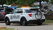 Trailer hitch-mounted rack on a police cruiser