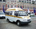 A white GAZ-322133 GAZelle taxi minibus