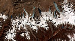 The termini of the glaciers in the Bhutan-Himalaya. Glacial lakes have been rapidly forming on the surface of the debris-covered glaciers in this region during the last few decades. According to USGS researchers, glaciers in the Himalaya are wasting at alarming and accelerating rates, as indicated by comparisons of satellite and historic data, and as shown by the widespread, rapid growth of lakes on the glacier surfaces. The researchers have found a strong correlation between increasing temperatures and glacier retreat.