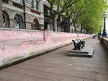 A section of the National Covid Memorial Wall in London National Covid Memorial Wall and a bench.jpg