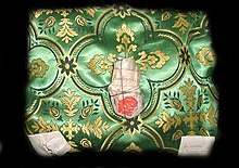 A relic from the shrine of Saint Boniface of Dokkum in the hermit-church of Warfhuizen: the bone fragment in middle is from Saint Boniface; the folded papers on the left and right contain bone fragments of Saint Benedict of Nursia and Bernard of Clairvaux. Reliekschrijnbinnen.jpg