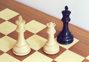 Black is checkmated and loses the game. CheckmateProper.jpg