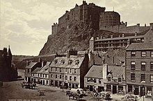 The castle is built on a volcanic rock, as seen here in a 19th century view from the Grassmarket area Edinburgh Castle from Grass Market.jpg