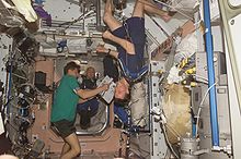 Astronauts on the ISS in weightless conditions. Michael Foale can be seen exercising in the foreground. Foale ZeroG.jpg