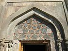 Intricately detailed tympanum above the portal of the zhamatun, an adaptation of Seljukid ablaq stonework.[6]