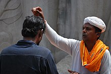 Hindu priest giving blessing. Hindu-priest-blessing.jpg