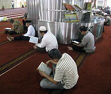 Indonesian Muslims reading the Quran in Masjid Istiqlal, Jakarta, Indonesia Istiqlal Mosque Reciting Al Quran.JPG