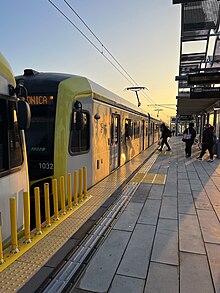 Westbound Metro E Line to Downtown Santa Monica Station stopped at Expo/Sepulveda Station Metro E line at Morning Golden hour.jpg