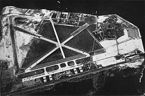 Aerial view of NAS New York in the mid-1940s, showing the original airfield (dark-colored ground) and the new additions (light-colored ground) NAS New York Floyd Bennet Field NAN1-48.jpg