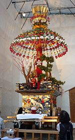 Colorful float with figure on top.