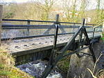 an iron bridge over a river