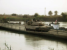 An Abrams crossing the Euphrates River at Objective Peach on ribbon assault float bridge deployed by the 299th Engineer Company in 2003 Abrams crossing Euphrates.JPG