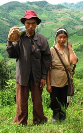 Bipedalism shown by a man and a woman Akha cropped.png