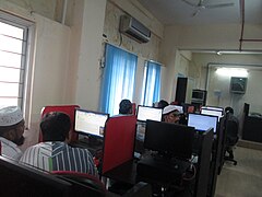 People glued to computers during the Urdu Wikipedia Workshop