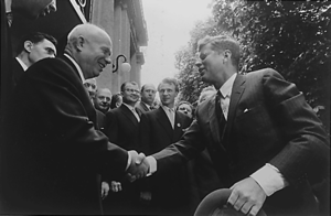 US President John F. Kennedy shaking hands wit...