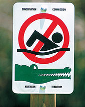 No Swimming sign used by Parks and Wildlife Commission of the Northern Territory. Kakadu 2430.jpg