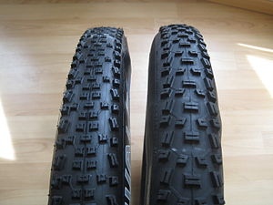 two mountain bike tires, same size (26, 2.1), ...