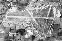 Aerial photograph of Fairford airfield, the bomb dump and ammunition dump are east (top) of the perimeter track, the technical site and barrack sites are on the north (lower left), 2 December 1943. RAF Fairford - 2 Dec 1943 Airphoto.jpg