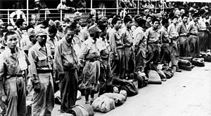 A group of Japanese prisoners of war in Australia during 1945 StateLibQld 1 80019 Japanese prisoners arriving at Brisbane from New Guinea, ca. 1945.jpg