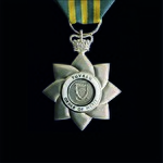 The insignia of the Tuvalu Order of Merit with St Edward's Crown Tuvalu Order of Merit.jpg