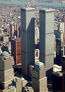 The nature of the collapse of the two World Trade Center towers and the nearby 7 World Trade Center (in this photo, the brown building to the left of the towers) is a major focus of 9/11 conspiracy theories. World Trade Center, New York City - aerial view (March 2001).jpg