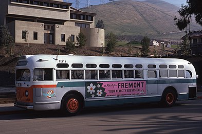 AC Transit #1811 purchased from Key System, repainted in "clownface" white/orange/green livery with turquoise/orange wing logo