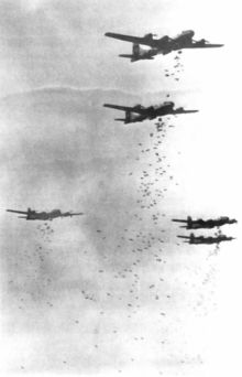 Strategic aerial bombing caused massive damage to cities B-29s dropping bombs.jpg