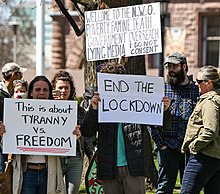 An anti-lockdown protest in front of the Ontario Legislative Building in Queen's Park, Toronto, April 25, 2020 Canadian COVID-19 protesters (cropped).jpg