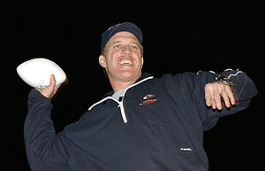 John Elway tosses footballs to the crowd durin...